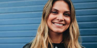 high-iq woman smiling feeling good