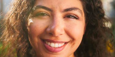 happy woman with tremendous inner strength smiling
