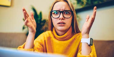 stressed woman feeling overworked and underappreciated in an office