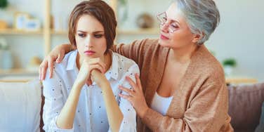 toxic mom comforting daughter but secretly feeling happy at her misery