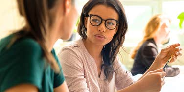 egotistical woman trying to humble intelligent colleague at work