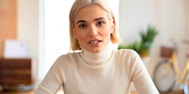 fake intellectual woman lying while speaking