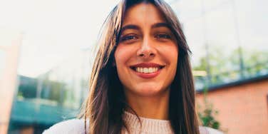 intelligent woman who thinks ahead smiling to herself