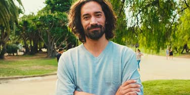 good man with impressive but rare behaviors standing outside 