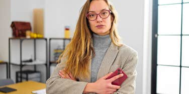 serious high-iq woman at work refusing to tolerate bad behavior