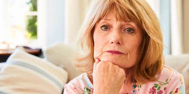 retired older woman feeling guilty about being bored at home