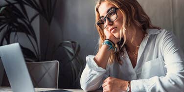 employee writing a work email that makes her look weak