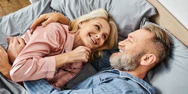 happy couple sleeping in bed