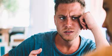man who is stressed out having a conversation with a friend