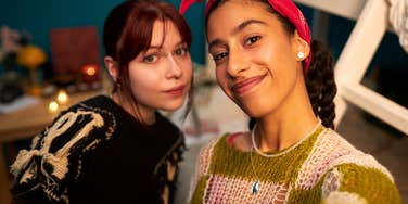 gen z women taking a selfie together not worrying