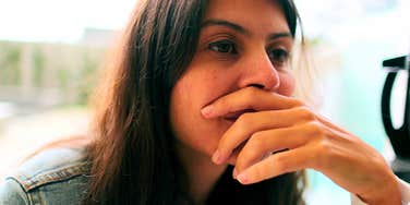 highly stressed perfectionist woman dealing with childhood trauma