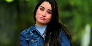 gen z woman looking annoyed and frustrated about millennials