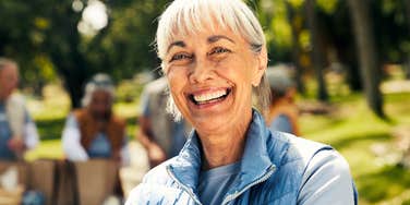 boomer woman smiling volunteering her time