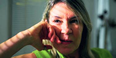 intelligent woman sitting alone at home disliking people
