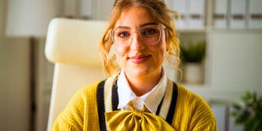 woman sitting at her work desk all day wanting to have fun