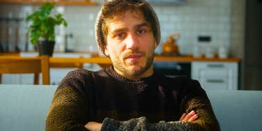 bored uninterested man being standoffish in conversation