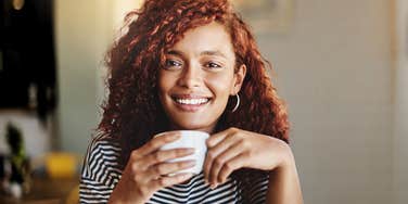 woman whose parents did an outstanding job raising her sipping coffee 