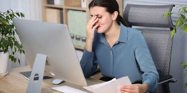 sad white-collar worker who is frustrated she can't advance in her career