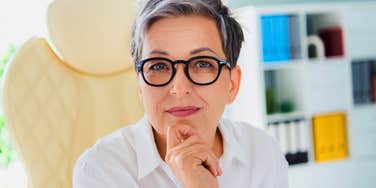 boomer woman with good work ethic sitting in office