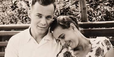 A textured 1950s era photograph of a group of attractive youth sitting closely together outdoors; illustrating 'structured connection' and the timeless dating ethics modeled by the older generation.