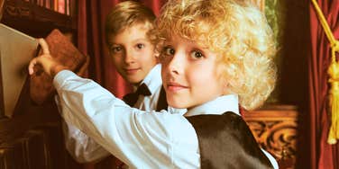 two kids learning old-fashioned life lessons from great parents