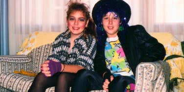 teens in the 1980s dressed up sitting on the couch
