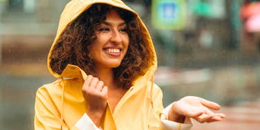 highly intelligent woman feeling joy being out in the rain