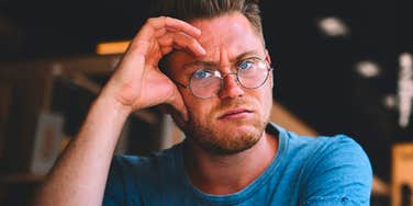 annoyed man feeling bored during conversation