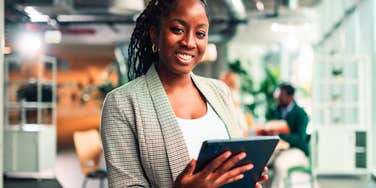 hardworking woman in office who learned life lessons to be successful