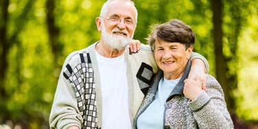 loving grandparents standing together outside