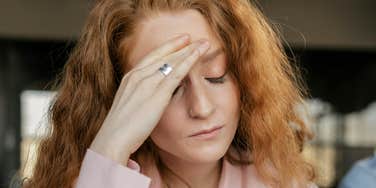 Nervous woman is faking being smart.