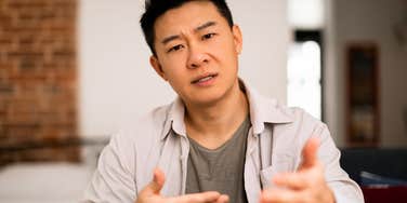annoying man involved in a serious conversation