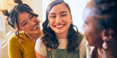 sarcastic woman making her friends laugh while talking