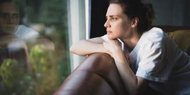 sad young woman feeling homesick