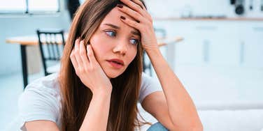young insecure woman worrying at home