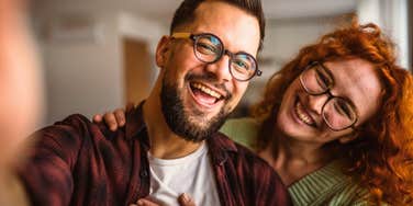 man with a pure heart taking selfie with woman he loves