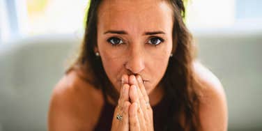 sad woman thinking deeply about her lonely childhood