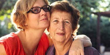 young woman hugs her mom after doing things that make her cry 