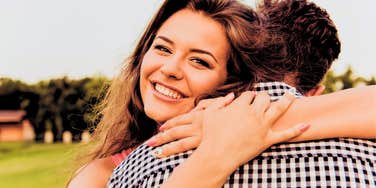 happy woman hugging man who loves her