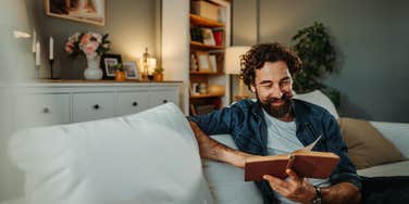 man relaxing after work because he can ignore messages from his boss