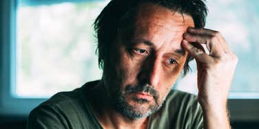 miserable man worrying about things in his life
