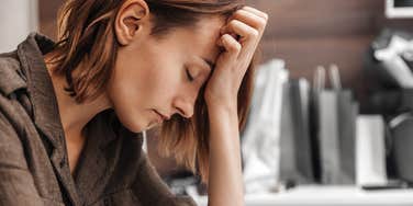 woman struggling at work because of her childhood trauma