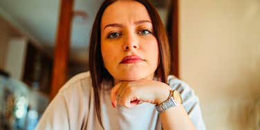 highly aware woman looking ahead thoughtfully