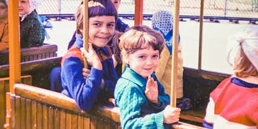 young children in the 1960s riding a trolley