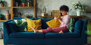 happy woman relaxing in her decorated living room