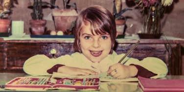 boomer child in the 1960s practicing writing skills