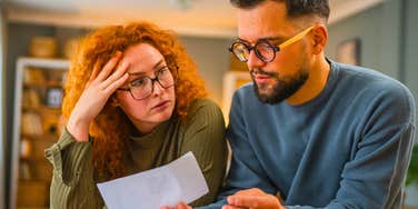 couple disagreeing after opening a bank account together