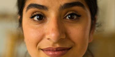 happy woman who is impossible to manipulate smiling up close