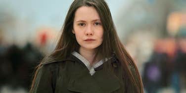 gen z millennials gen x and boomers idea of what a poor person looks like Serious Gen Z woman thinking about what it means to be poor