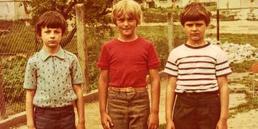 kids in the 1970s standing outside feeling free